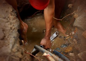 Plumber in Trench